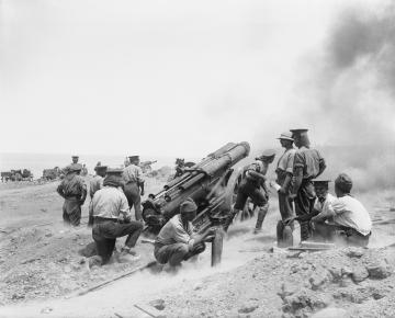 A British 60 pounder Mk I battery in action on a cliff top at Cape Helles, Gallipoli